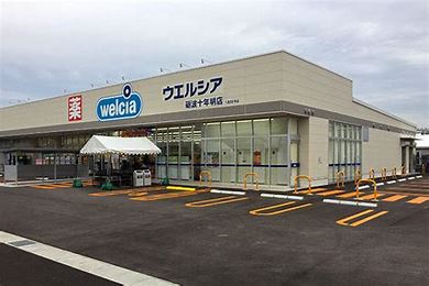 ドラックストア　ウェルシア砺波十年明店（ドラッグストア）まで891m