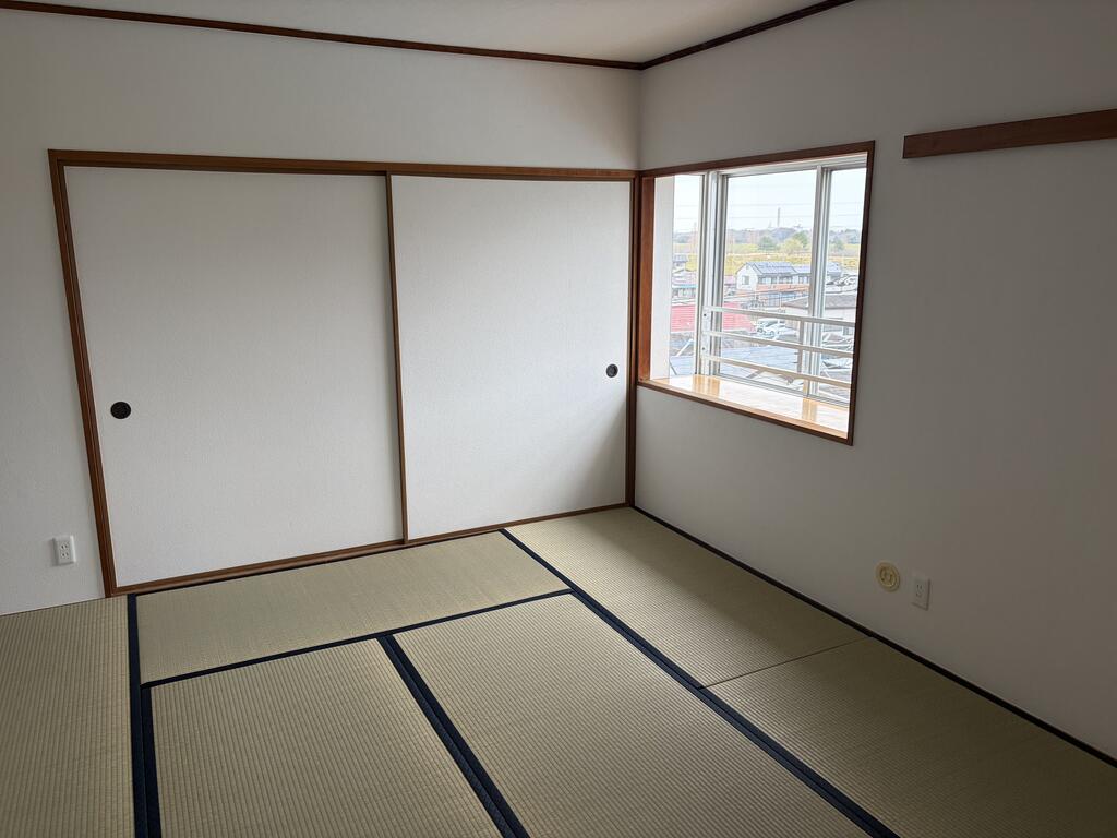 川越グリーンパークA-1号棟の居間写真