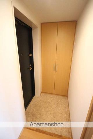 地下鉄南北線 麻生駅 徒歩3分 4階建 築20年の玄関写真