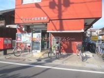 郵便局　足立江北四郵便局（郵便局）まで494m