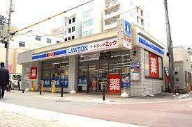 ドラックストア　ローソン＋ドラッグミック江坂広芝町店（ドラッグストア）まで372m