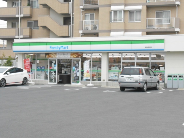 コンビニ　ファミリーマート越谷恩間店（コンビニ）まで348m