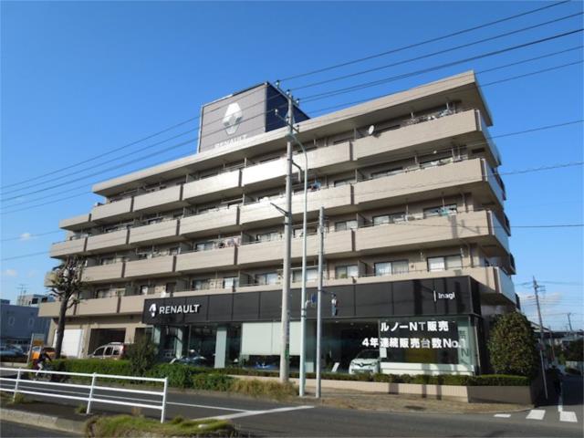 稲城市東長沼のマンションの建物外観