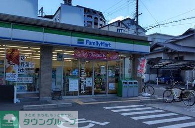 コンビニ　ファミリーマート吹田千里山高塚店（コンビニ）まで580m