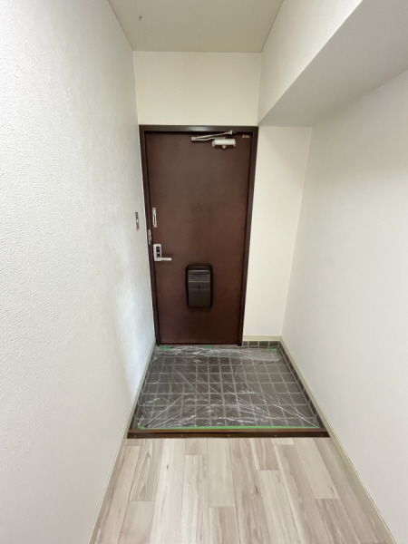 城西シティー彦和の玄関写真