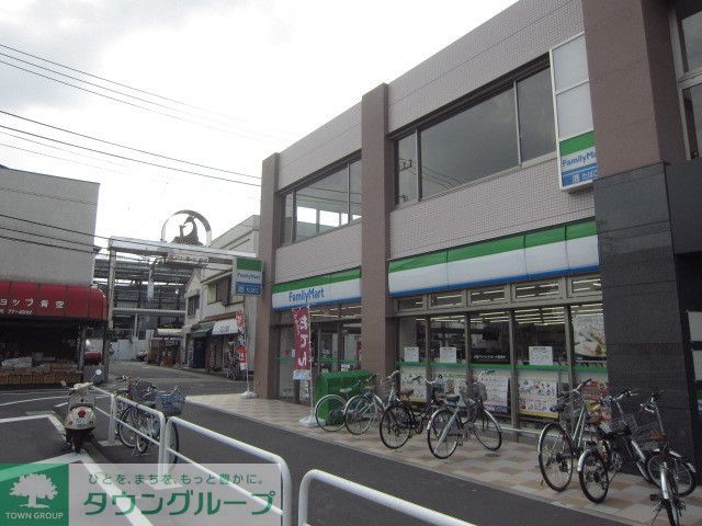コンビニ　ファミリーマート稲城長沼駅前店（コンビニ）まで590m