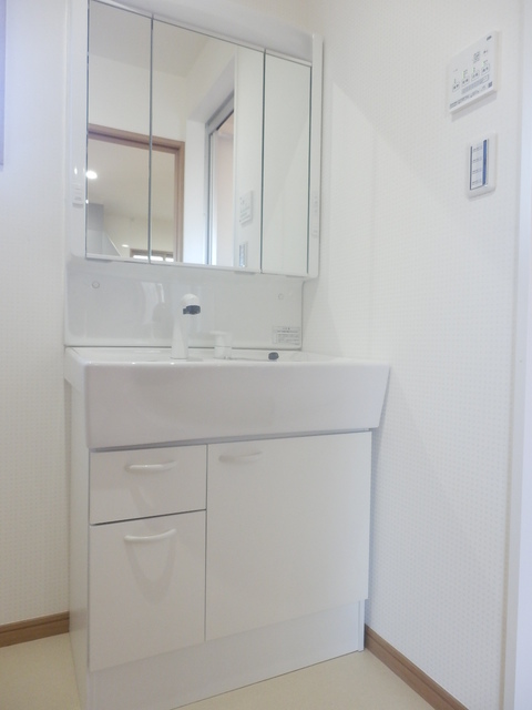 洗面設備　※別号棟のお写真です。現状と異なります。