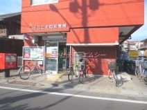 郵便局　足立江北四郵便局（郵便局）まで303m
