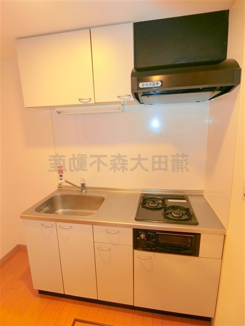 キッチン　2口ガスグリル付システムキッチン　まな板が置ける調理スペース