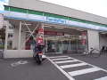 ショッピングセンター　ファミリーマート 伊丹中野西店（ショッピングセンター）まで1084m