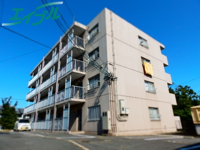 桑名市長島町西外面のマンションの建物外観