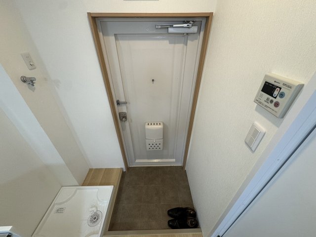 良本三川口マンションの玄関写真