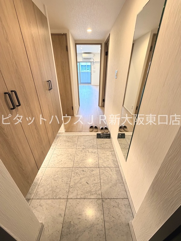 地下鉄御堂筋線 新大阪駅 徒歩5分 15階建 築20年の玄関写真