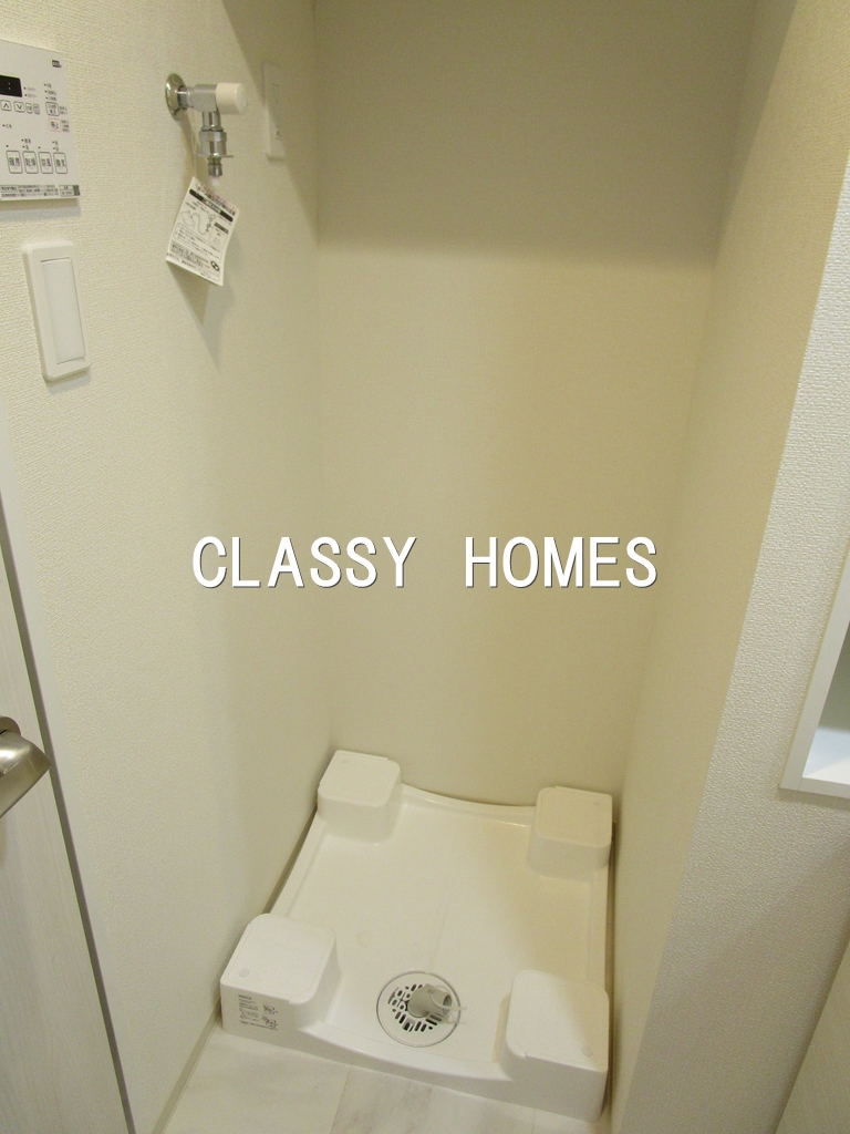 その他設備　2022年竣工　クレイシアアイズ三田：洗濯機置き場