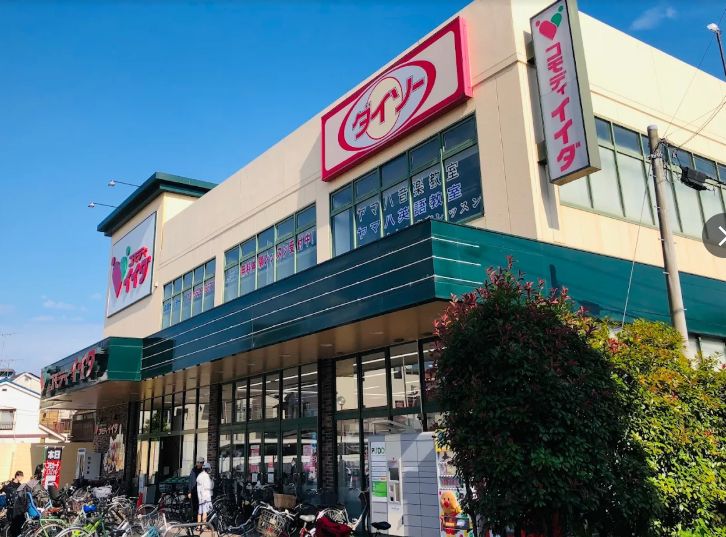 スーパー　コモディイイダ小菅店（スーパー）まで379m