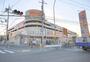 ショッピングセンター　ユニクロホームズ寝屋川店（ショッピングセンター）まで927m