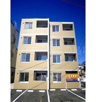 札幌市豊平区月寒西三条のマンションの建物外観