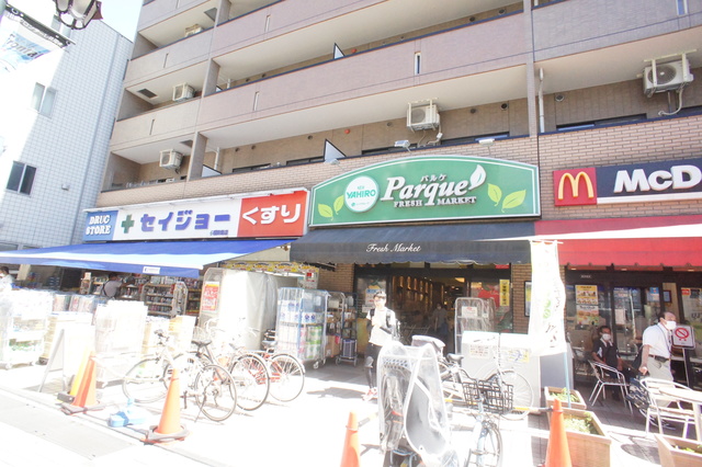 ドラックストア　くすりセイジョー稲田堤店（ドラッグストア）まで487m