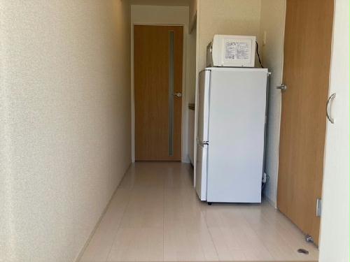 その他　1Ｆの扉の色はベージュ、2Ｆはブラウン。