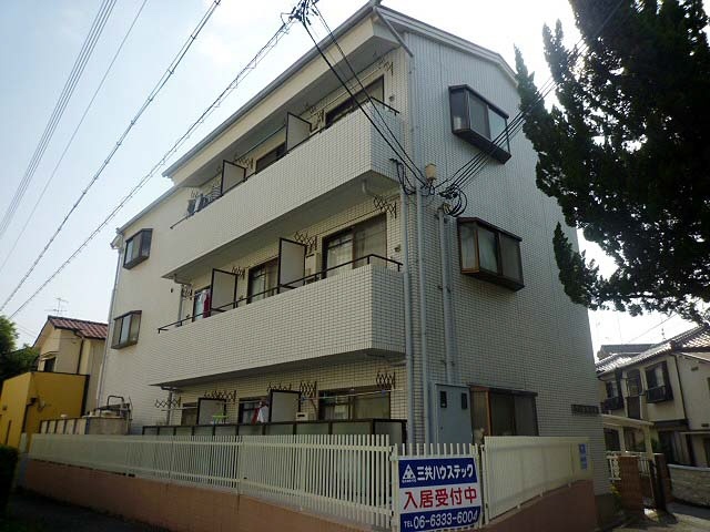 池田市井口堂のマンションの建物外観