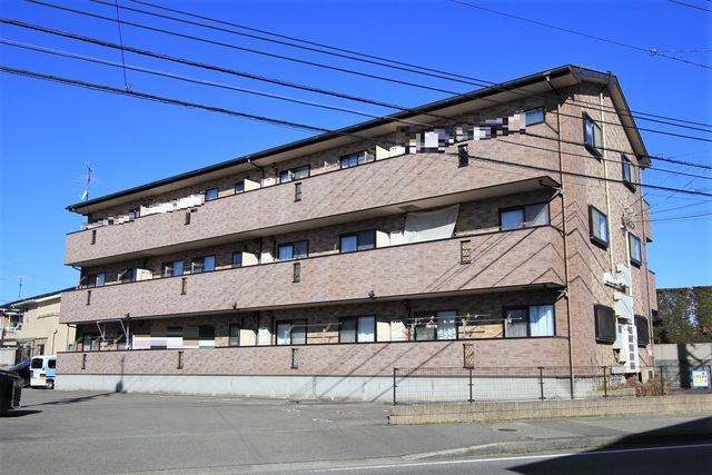 【松山市堀江町のマンションの建物外観】