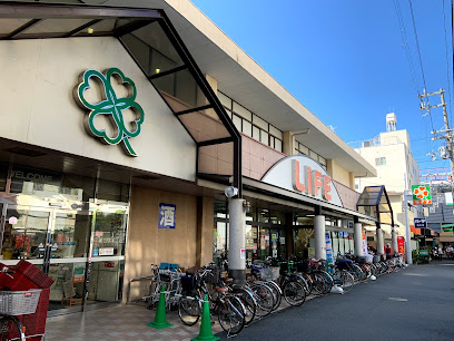 スーパー　ライフ塚本店（スーパー）まで295m