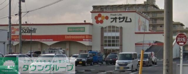 コンビニ　スーパーオザム新堀店（コンビニ）まで400m