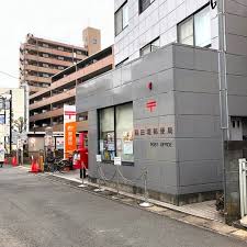 郵便局　稲田堤郵便局（郵便局）まで141m
