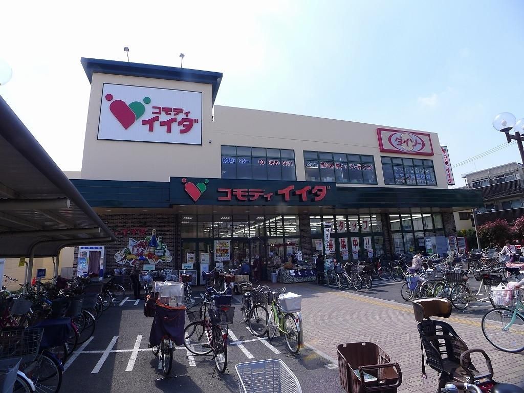 スーパー　コモディイイダ小菅店（スーパー）まで390m