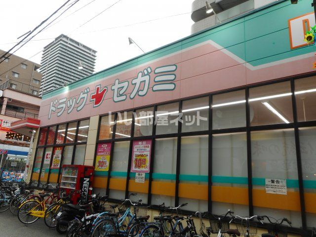 ドラックストア　ココカラファイン ドラッグセガミ香里店（ドラッグストア）まで990m