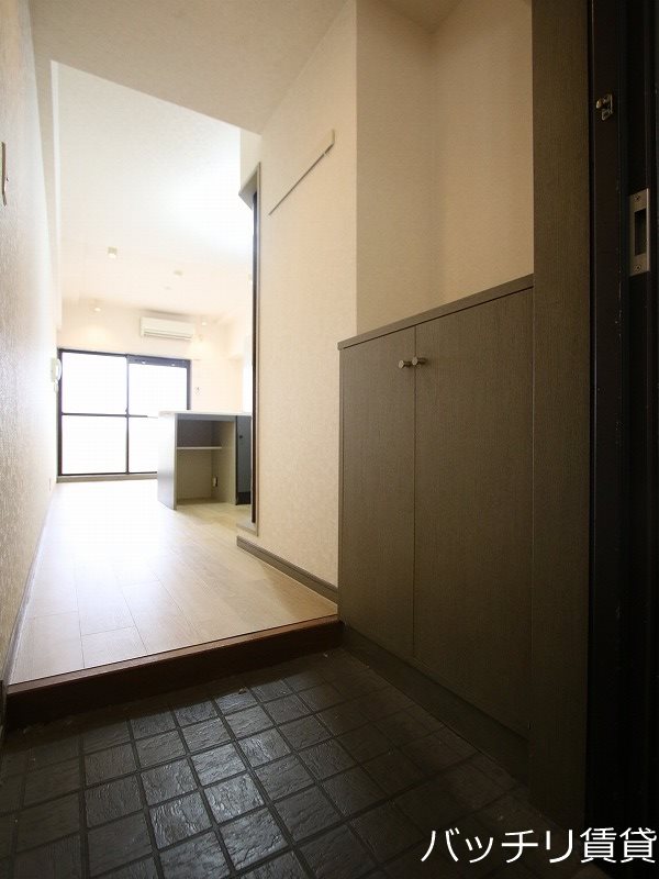 玄関　別号室写真の為、現状優先。