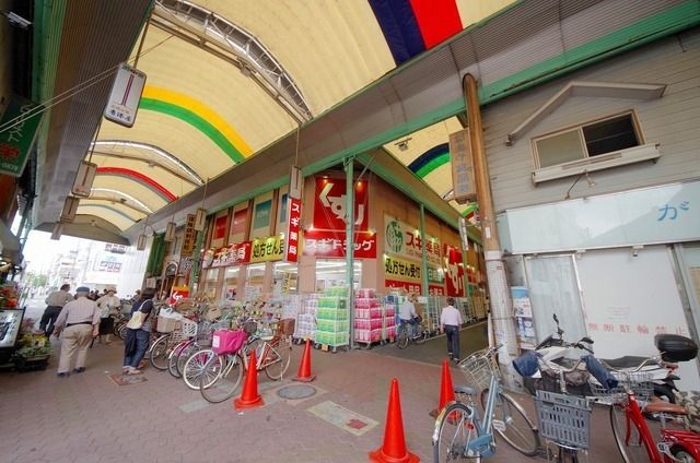 ドラックストア　スギ薬局蒲生店（ドラッグストア）まで487m