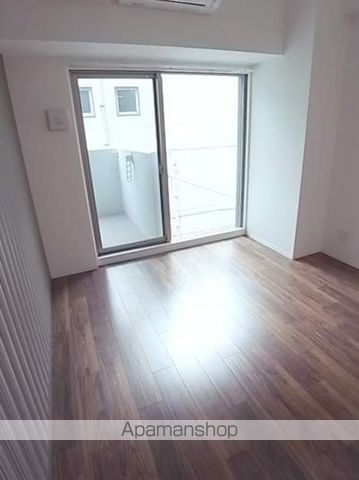 プレミアムコート谷町4丁目の居間写真