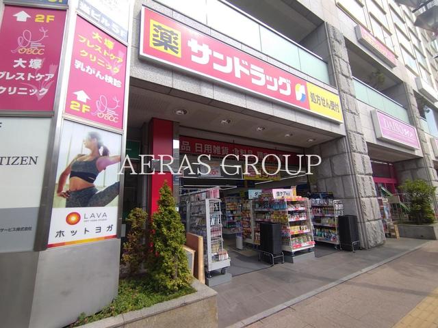 ドラックストア　サンドラッグ 竹の塚店（ドラッグストア）まで395m