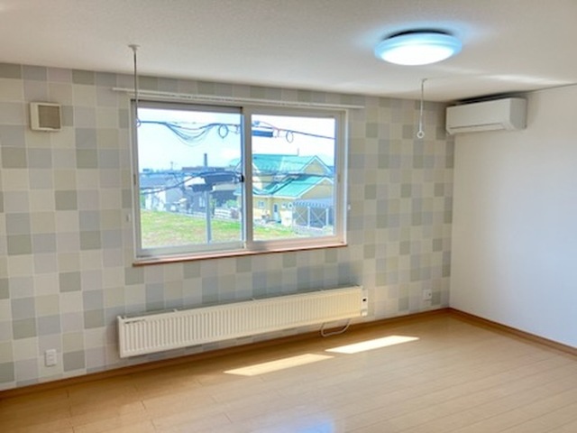 リビングタウン山の手 Eの居間写真