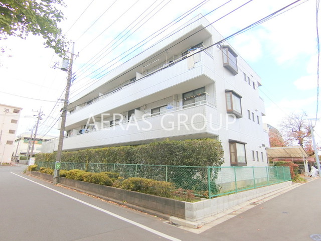 【狛江市和泉本町のマンションの建物外観】