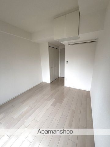 地下鉄御堂筋線 心斎橋駅 徒歩4分 15階建 築9年の居間写真